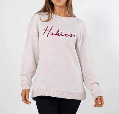 a cream colored sweater