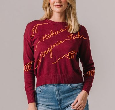 a maroon sweater